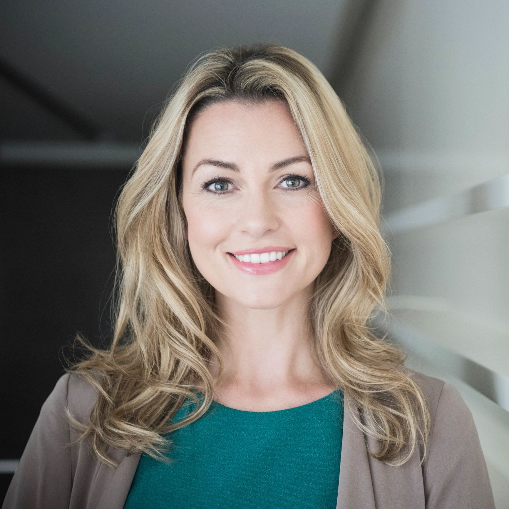 Portrait headshot of a smiling professional woman